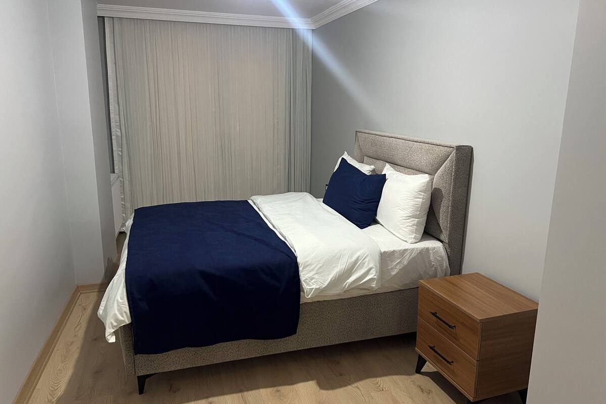 Premium bedding, laptop workspace, iron/ironing board, bed sheets