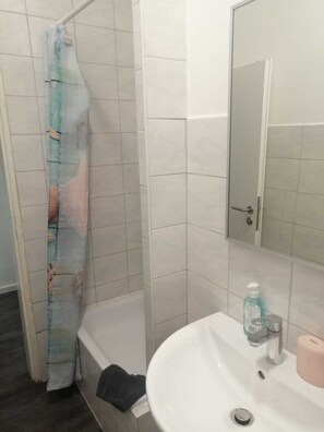 Shower, hair dryer, towels, toilet paper