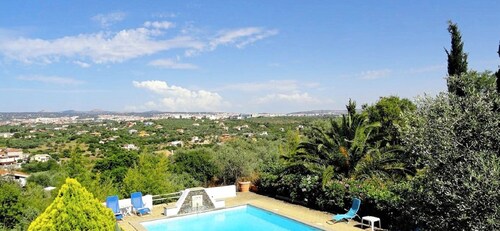 Casadellameridiana Family villa set in an olive grove, with views and swimming pool.