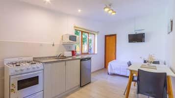 Basic Apartment, Non Smoking, Patio | Living area | TV