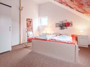 A bedroom with a bed, bedside tables, a window, and a door. - Atmospheric Holiday Home With a Swimming Pool (gmina Dobra)