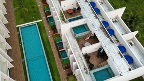 A hotel with multiple swimming pools, outdoor seating areas, and a well-maintained lawn. - MHV Milagres - Manah B 212 &  B 211  (São Miguel dos Milagres)