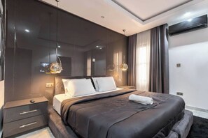 Economy Room, Balcony, City View | Desk, laptop workspace, blackout drapes, soundproofing