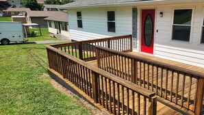 A residential house with a wooden deck and a red door. - 3324 Barbury LN, 37931 (Knoxville)