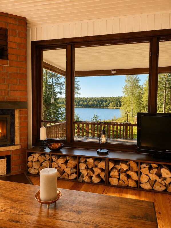 TV, fireplace - Swedish Magic - Exclusive Swedish Lake House with Boat and Guest House (Belganet)