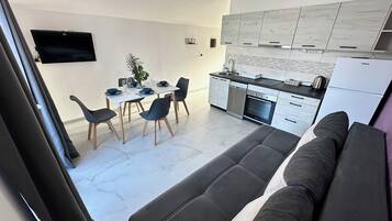 Luxury Apartment, Sea View | Living area | TV
