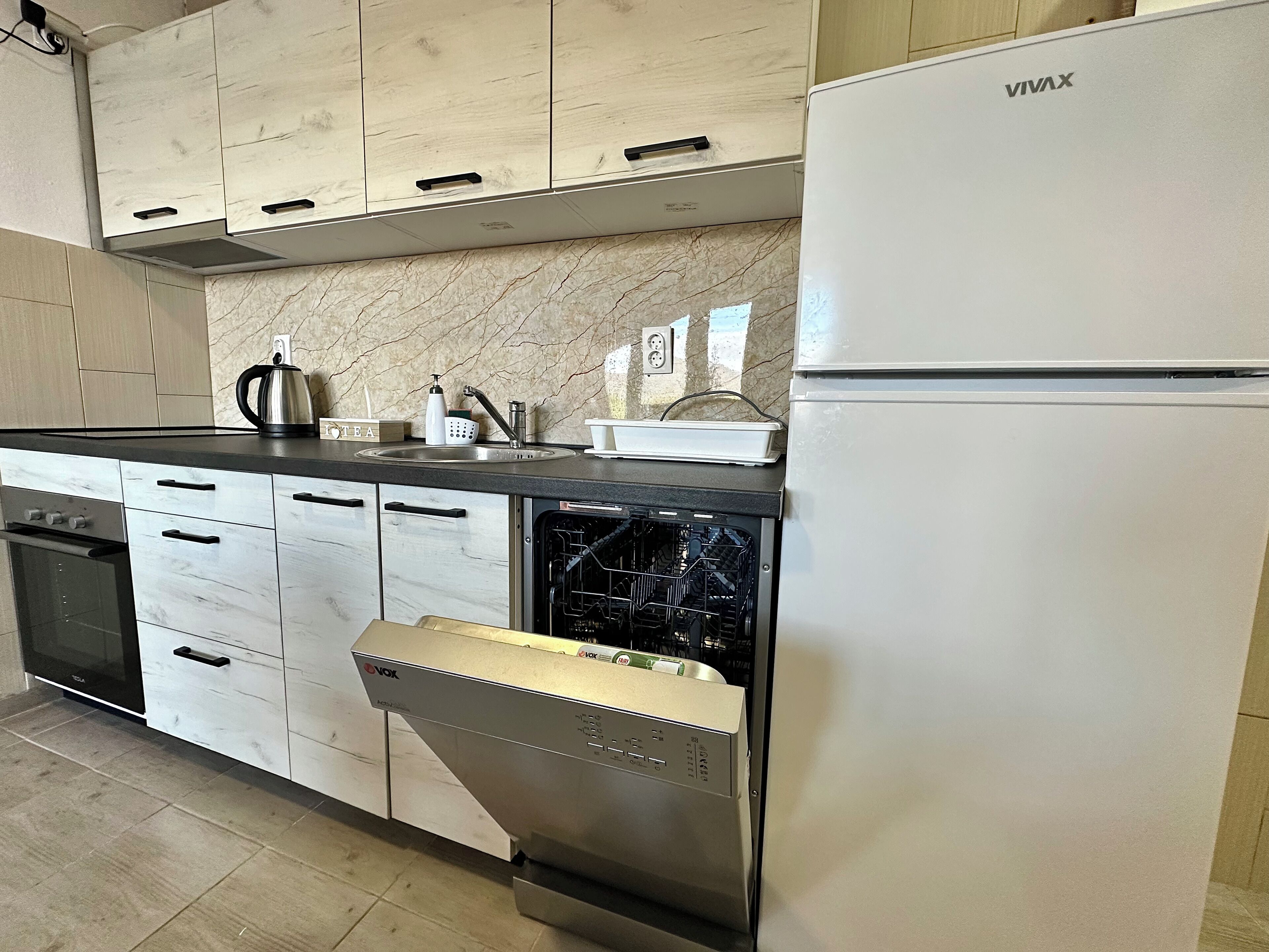 شقة عائلية - بمنظر للبحر | مطبخ خاص | ثلاجة/مجمد بحجم كبير، موقد طهي مسطح، غسالة أطباق