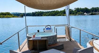 Neon House Boat—Luxury Stay on Lake Maggiore with a Hot Tub