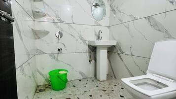 Deluxe Double Room, City View | Bathroom | Shower, slippers, towels