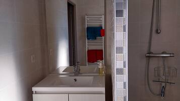 Shower, towels, soap, toilet paper