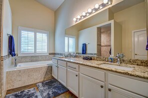 A modern bathroom with a large vanity, two sinks, a bathtub, and a walk-in shower. - Heated pool Hot tub pool table (Mesa)