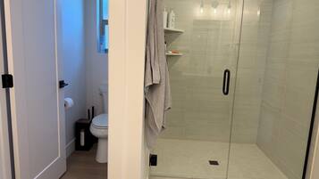 Shower, hair dryer, towels, soap