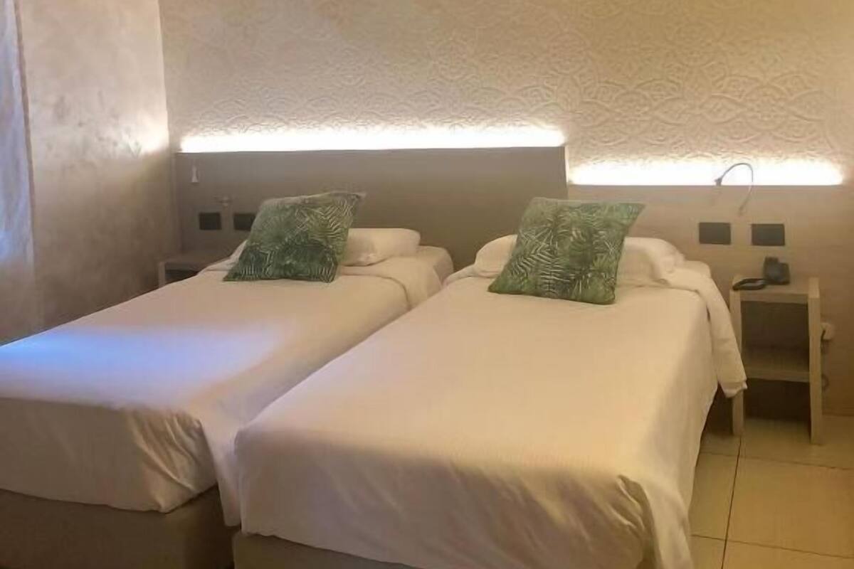 Twin Room, 2 Twin Beds, Non Smoking | Minibar, in-room safe, desk, blackout drapes
