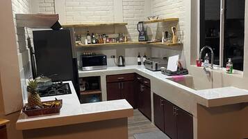 Fridge, microwave, stovetop, coffee/tea maker