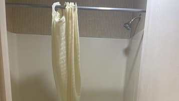 Bathtub, towels, soap, shampoo