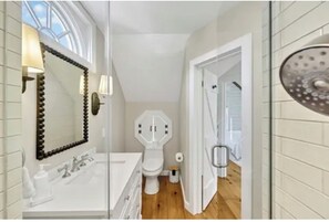 Shower, hair dryer, towels, toilet paper