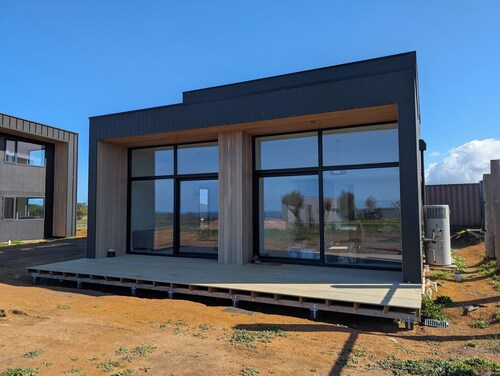 Modern home with pool + ocean and farm views!