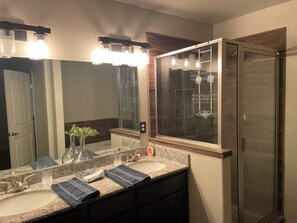 Shower, hair dryer, towels, soap - Your Home Away From Home-3 Bedrooms, 2 Baths. (Hobbs)
