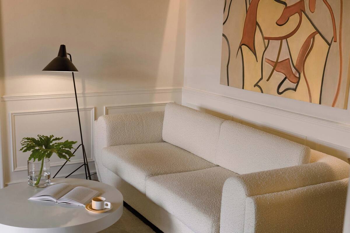 Luxury Suite, Courtyard View | Living area | TV