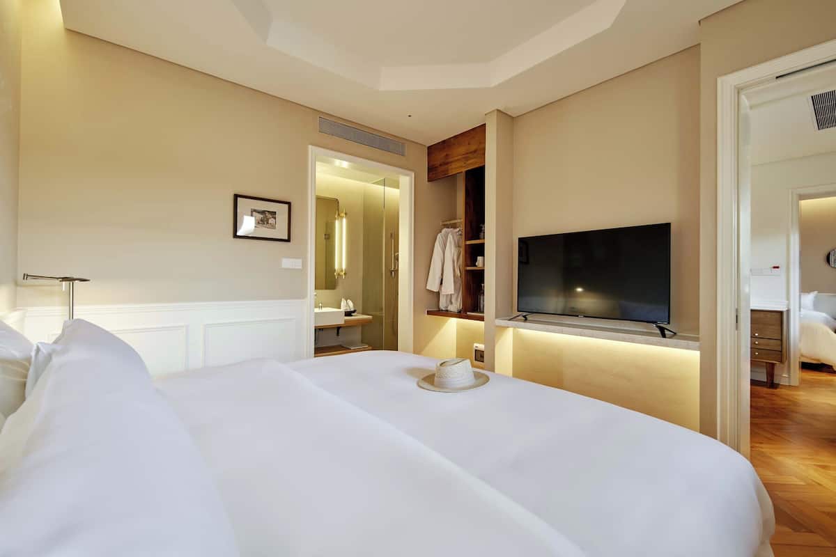 Family Suite, Courtyard View | Desk, laptop workspace, blackout drapes, free WiFi