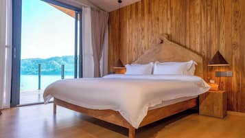 Luxury Suite, Lake View | Blackout drapes, iron/ironing board, free WiFi, bed sheets