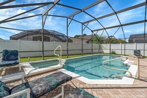 Outdoor pool, a heated pool - Charming 5BR/4BA Near Disney/ Pool, Sauna & Pets (Kissimmee)