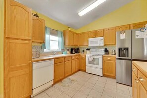 Fridge, microwave, oven, stovetop - Charming 5BR/4BA Near Disney/ Pool, Sauna & Pets (Kissimmee)