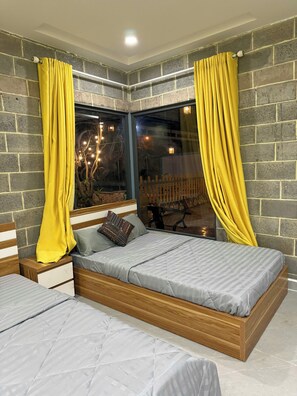 Comfort Triple Room, Garden View | Blackout drapes - Homestay Bich Hue Nova Phan Thiet (Phan Thiet)