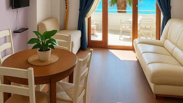 Apartment (One Bedroom apartment with Balcony an) | Living room | 32-inch flat-screen TV with satellite channels