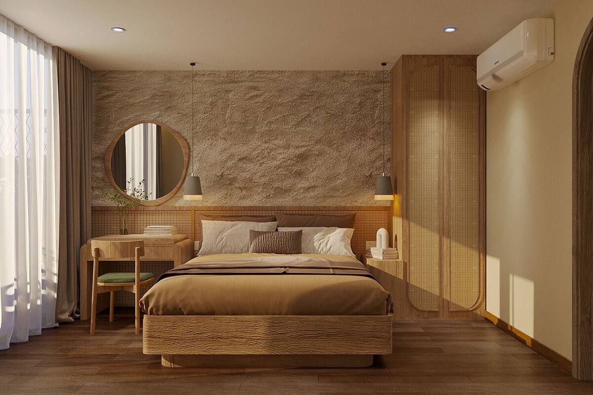 Een moderne slaapkamer met een groot bed, een ronde spiegel, een bureau en een wandairconditioner.