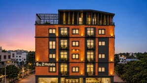 A multi-story hotel with a modern design, featuring balconies and large windows. - S By Z Hotels HSR (Bengaluru)