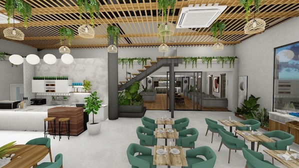 A modern interior with a staircase, seating areas, and a kitchen. - S By Z Hotels HSR (Bengaluru)
