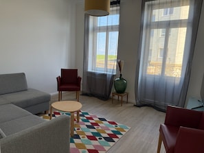 Comfort Apartment, 1 Bedroom, Partial Ocean View | Living area | 50-inch flat-screen TV with cable channels, streaming services - Apartment Bake9 - Tide (Cuxhaven)