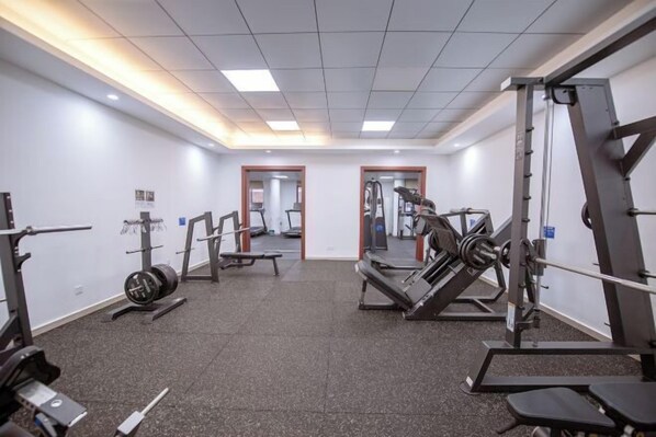 A gym with various exercise equipment, including weight machines and cardio machines. - Wuling Hotel (Liuzhou High-speed Railway Station) (Liuzhou)
