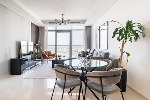 Living area - Elegant 1BR Apartment, Rooftop 360° Infinity Pool with Burj Views (Dubai)