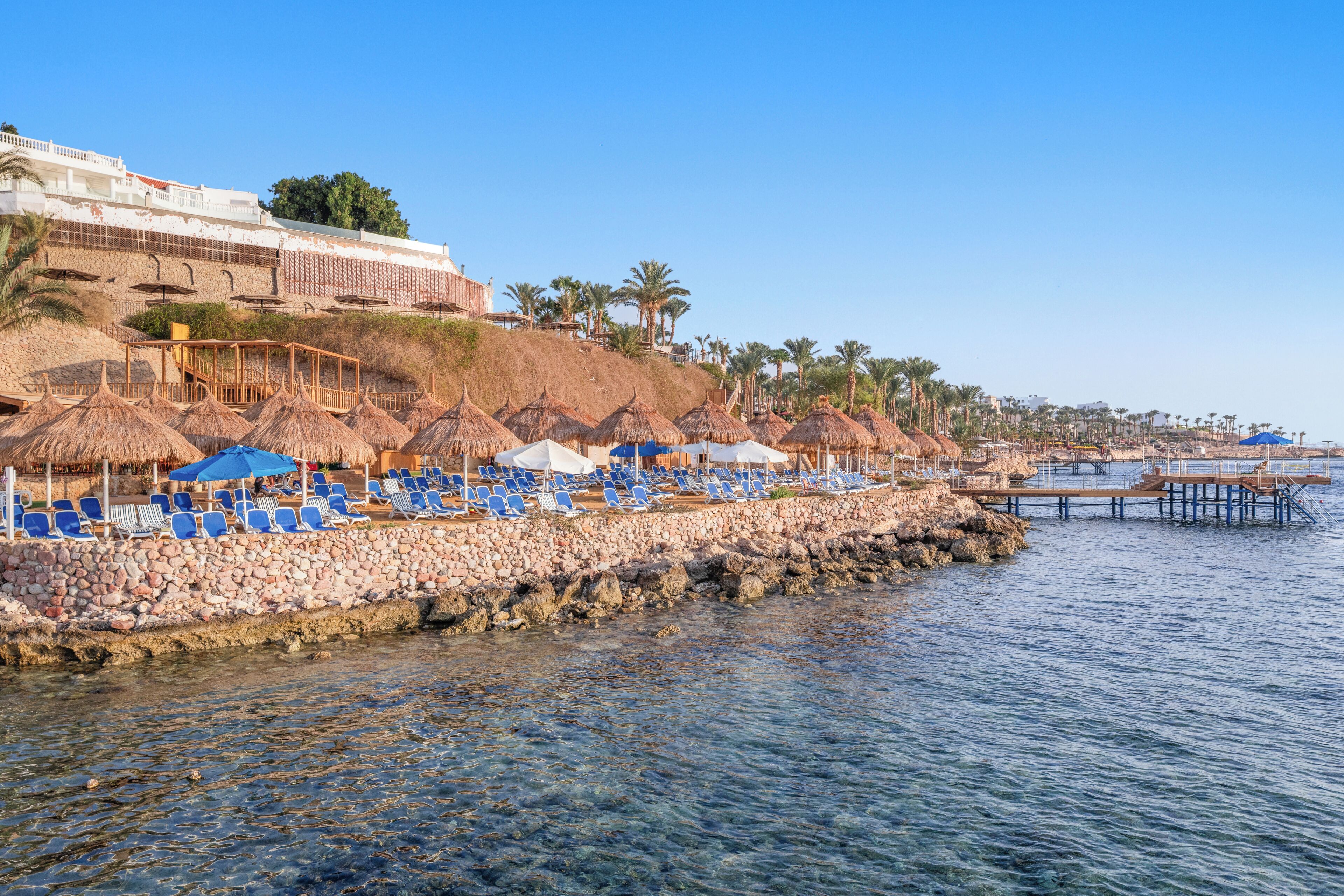 On the beach, sun-loungers, beach umbrellas, beach towels