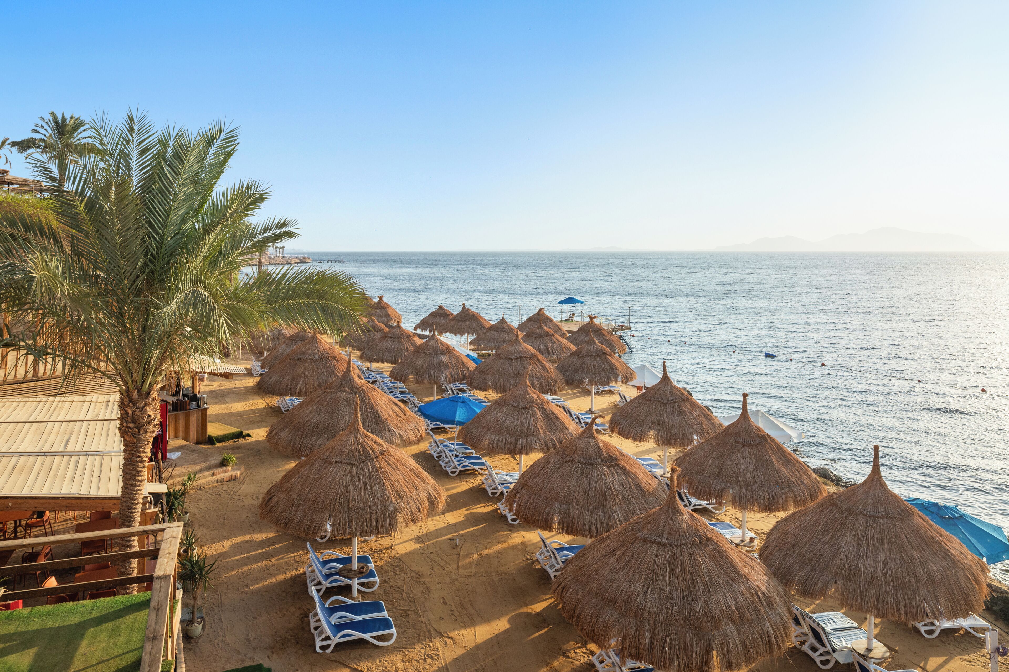 On the beach, sun loungers, beach umbrellas, beach towels