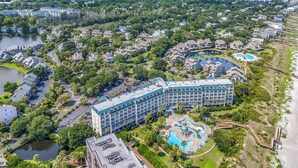 A resort with multiple buildings, a large pool area, and a beach. - Oceanfront Luxury 2BR Litchfield Beach Escape (Pawleys Island)