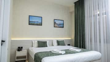 Premium bedding, down comforters, minibar, in-room safe