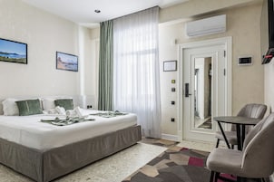Premium bedding, down comforters, minibar, in-room safe