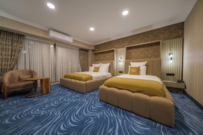 Deluxe Triple Room, Garden View | In-room safe, desk, laptop workspace, blackout drapes - Hanzade Hotel (Edremit)