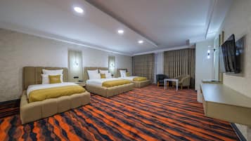 Deluxe Quadruple Room, Housekeeping, Mountain View | Premium bedding, in-room safe, desk, laptop workspace