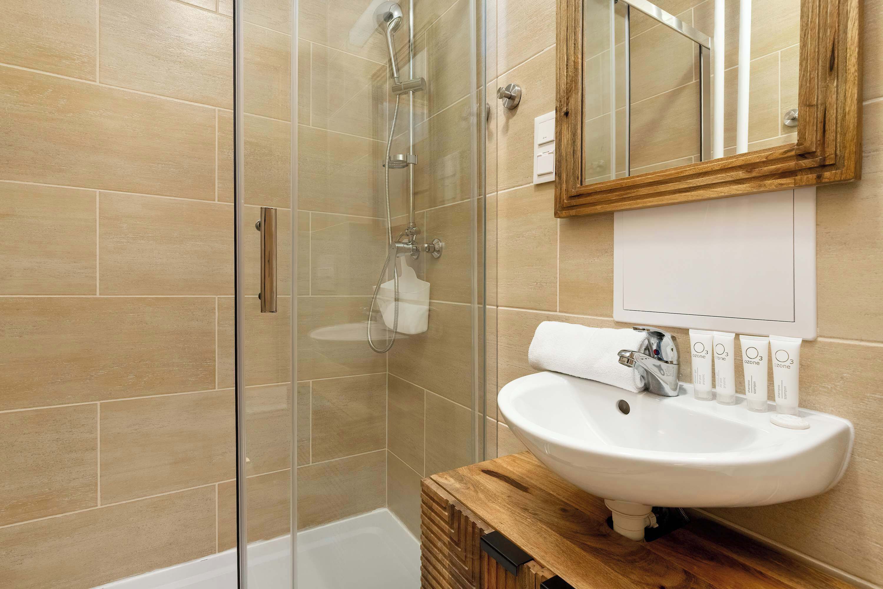 Shower, hair dryer, towels, shampoo