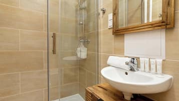 Shower, hair dryer, towels, shampoo