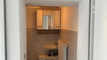 Dusj, håndklær, såpe og sjampo