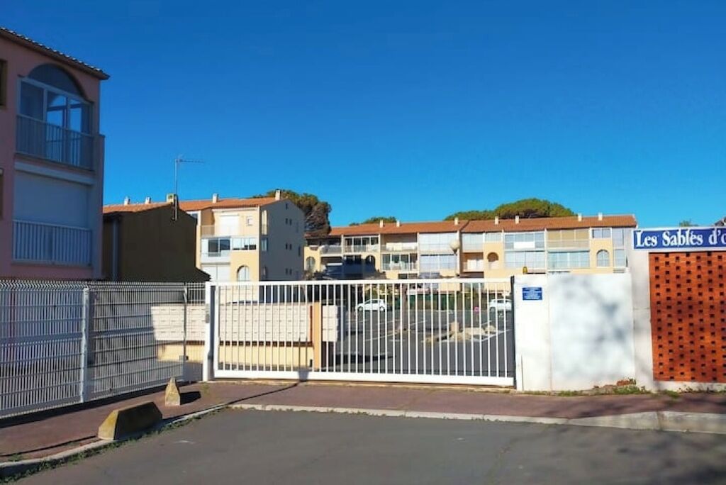 A gated residential area with a clear sky.