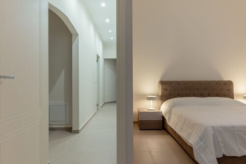 GuestHost - Elegant and spacious 104 square meters apartment, perfect for four people, located on the ground floor of a historic building.The property is just steps from the Collegiate Basilica of San Sebastiano and the Cathedral Basilica of Maria SS.ma 
