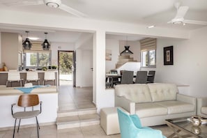 Superior Townhome | Living area | 50-inch Smart TV with cable channels - Pantaros Luxury Villas with pool (Protaras)
