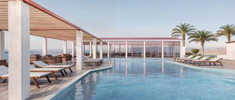 Seasonal outdoor pool, pool loungers