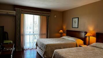 Standard Quadruple Room, Garden View | In-room safe, blackout drapes, free WiFi